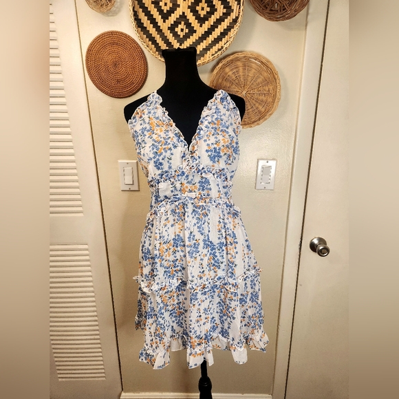 LAST ONE! Blue And White Floral Mini Dress With Ruffles And Criss-Cross Back - Picture 4 of 11